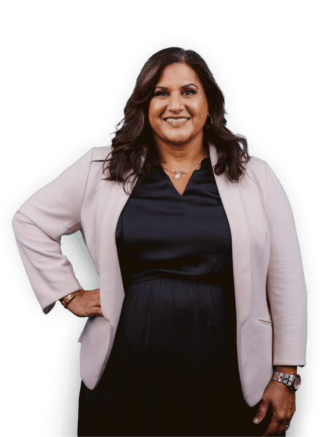 Professional woman in a blazer facing forward and smiling