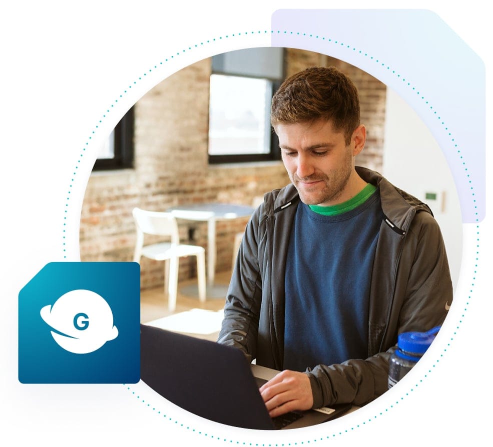 Man works on laptop using Genesis to build his site