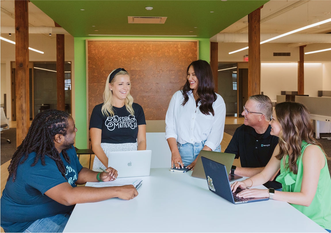 omaha hub of group of people talking around a table