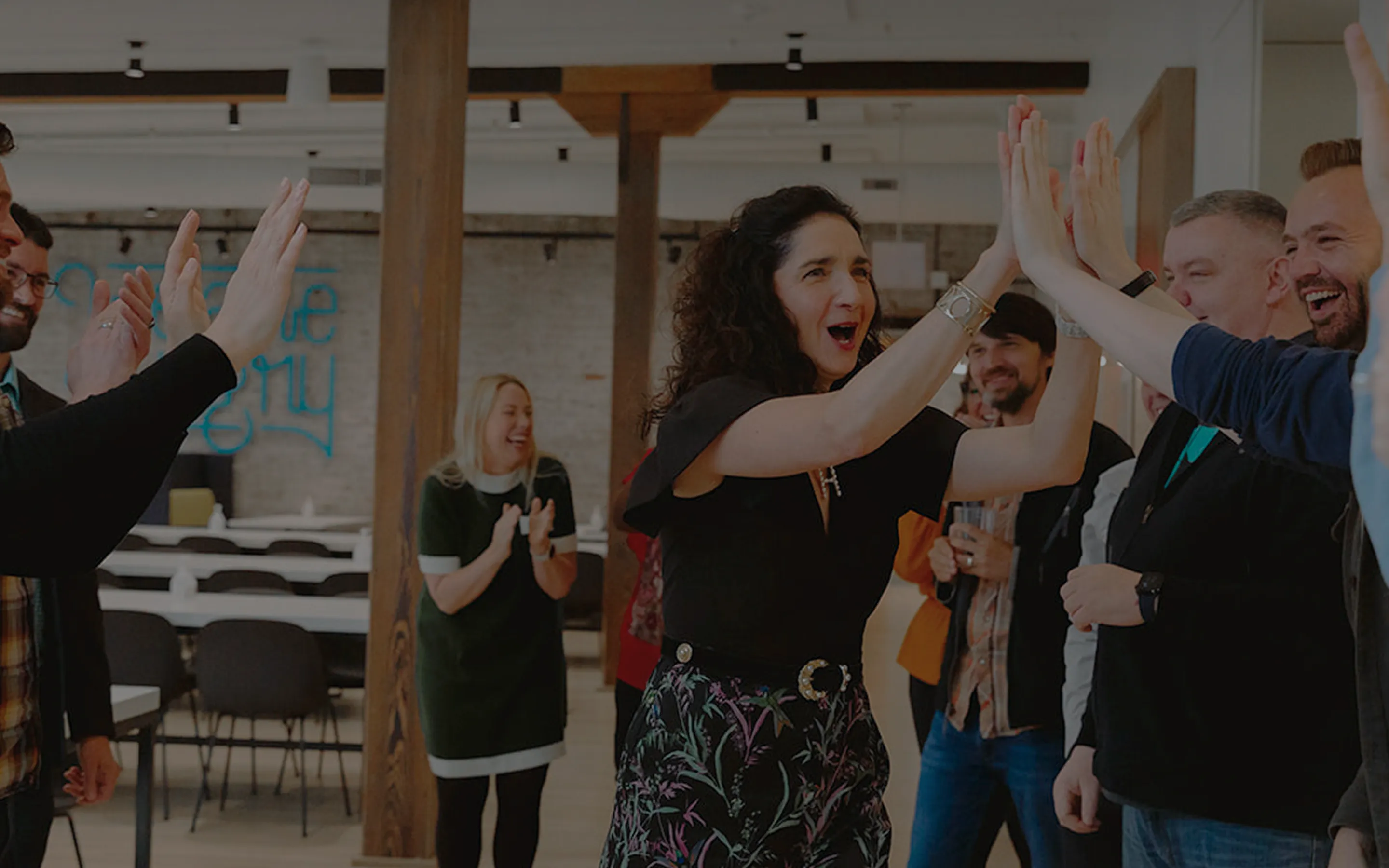 careers hero with employees celebrating